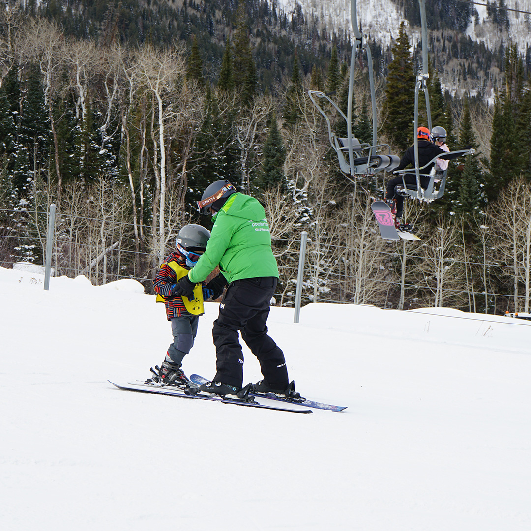Skiers riding the lift at Powderhorn